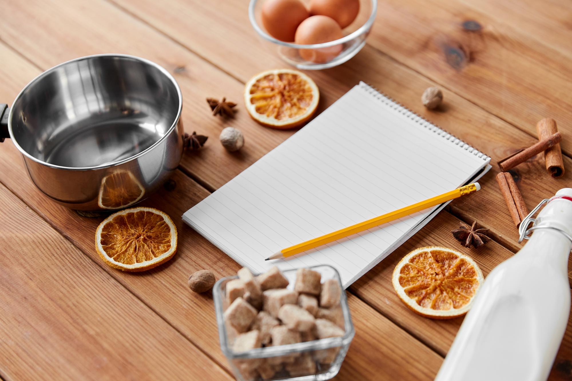 Kitchen workspace with utensils and recipe notebook